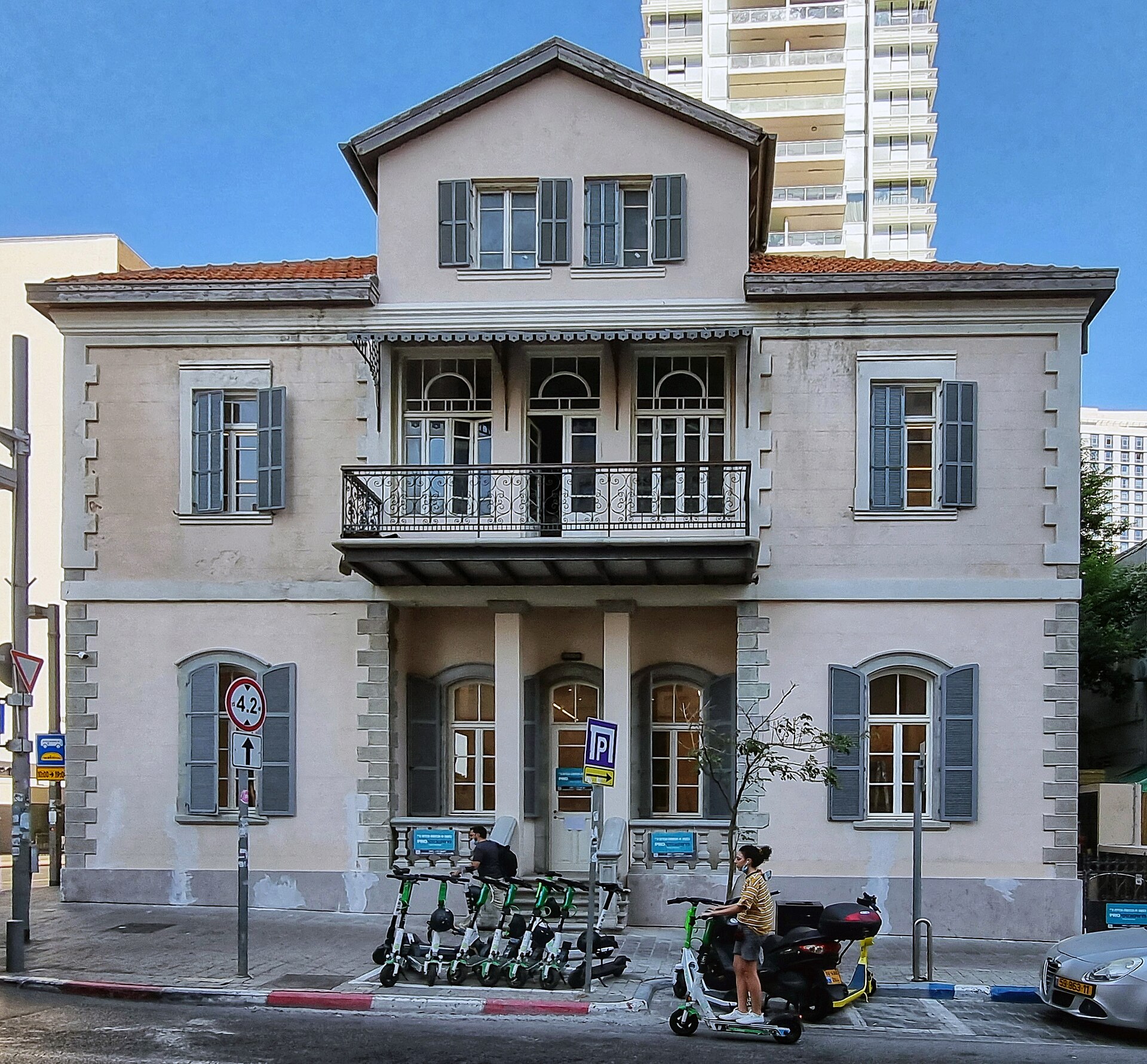 Preserved historic building in Tel Aviv surrounded by contemporary urban architecture